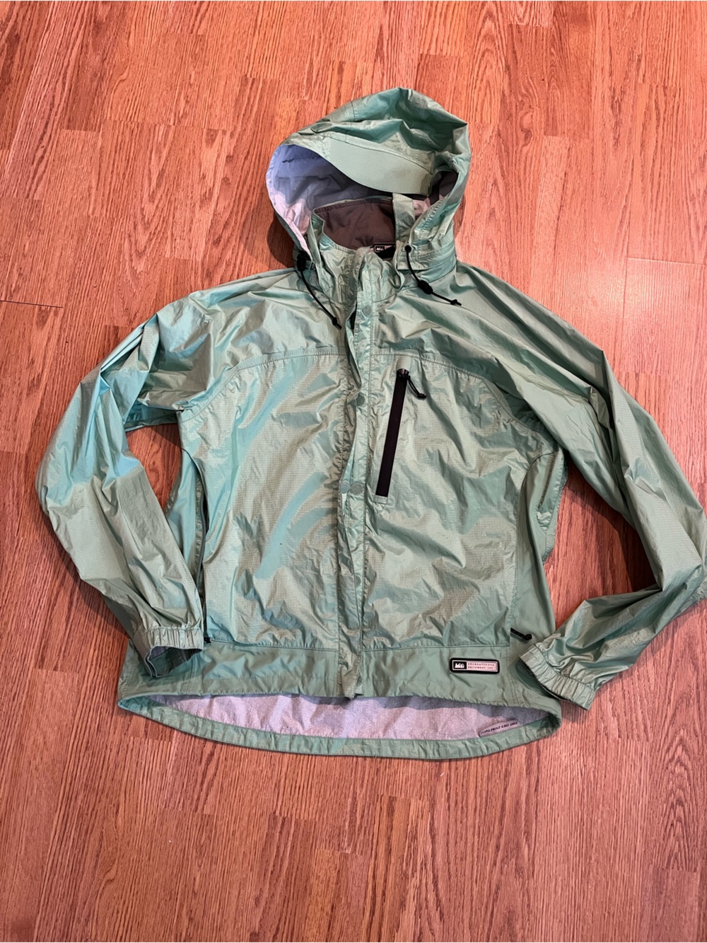REI women’s mint green lite weight jacket.